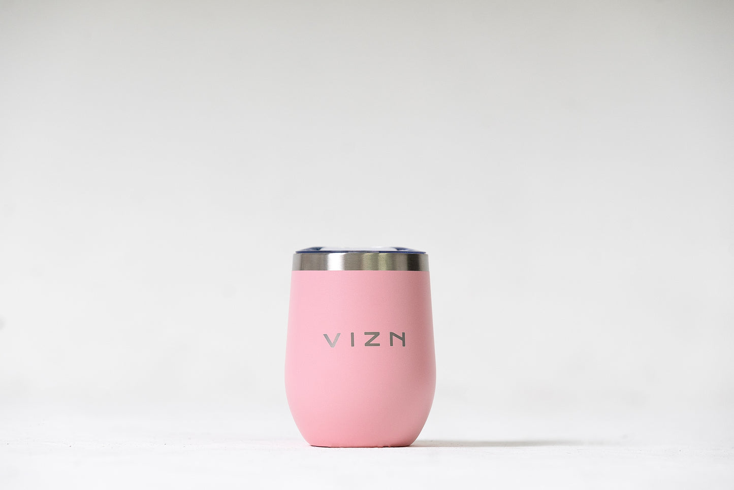 Sipper Tumbler in Coral Pink with an open spout lid, showcasing its double-walled stainless steel design.