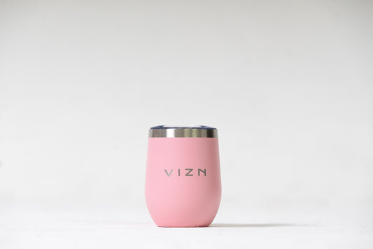 Sipper Tumbler in Coral Pink with an open spout lid, showcasing its double-walled stainless steel design.