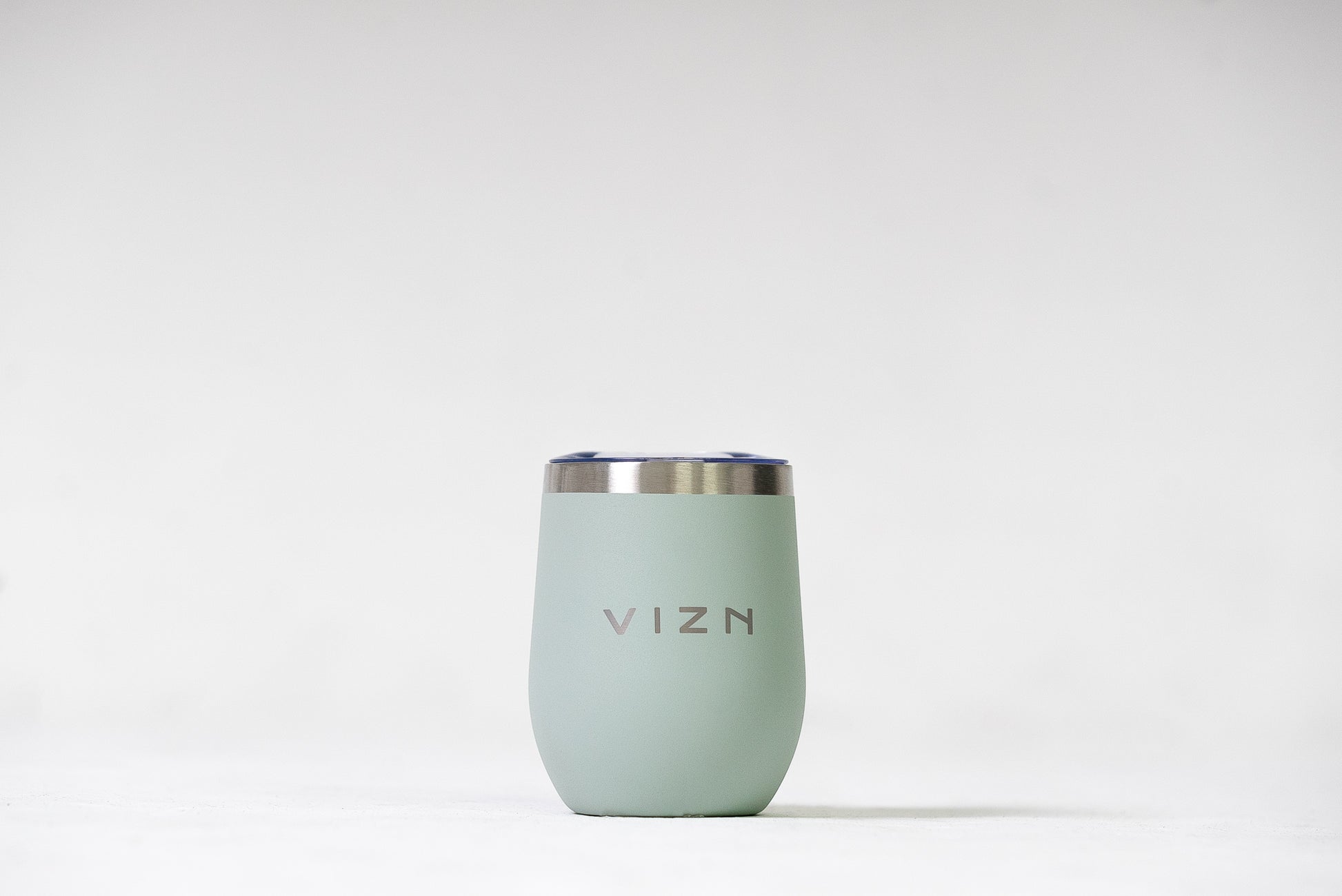 Sea Foam Green Sipper Tumbler with a close-up view of its sleek stainless steel finish.