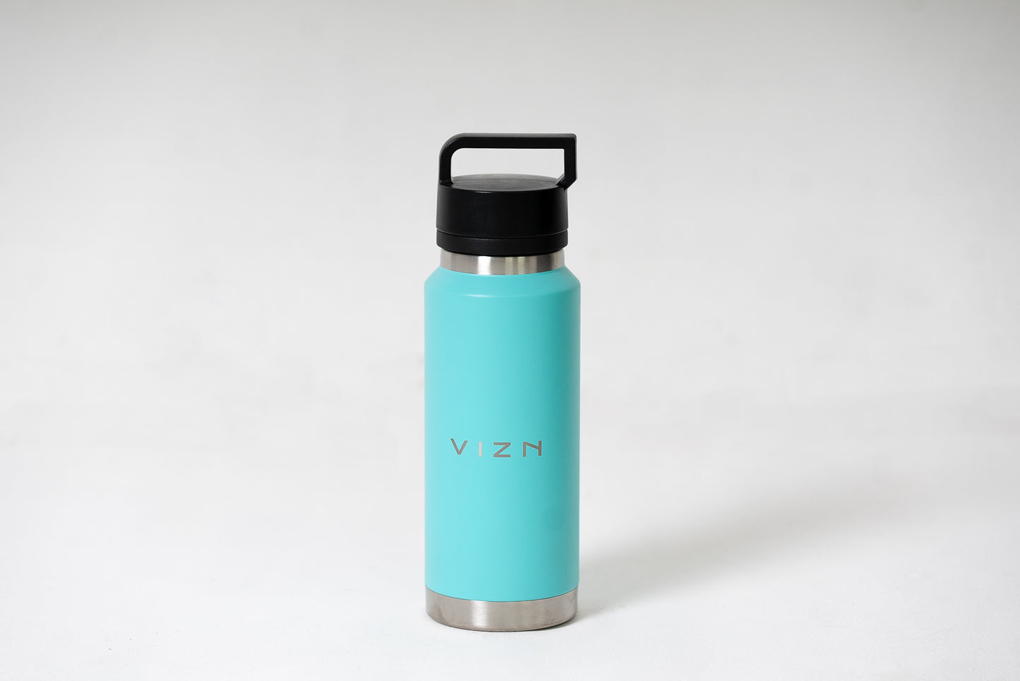 Double-walled water bottle in turquoise with screw top lid and condensation-free design