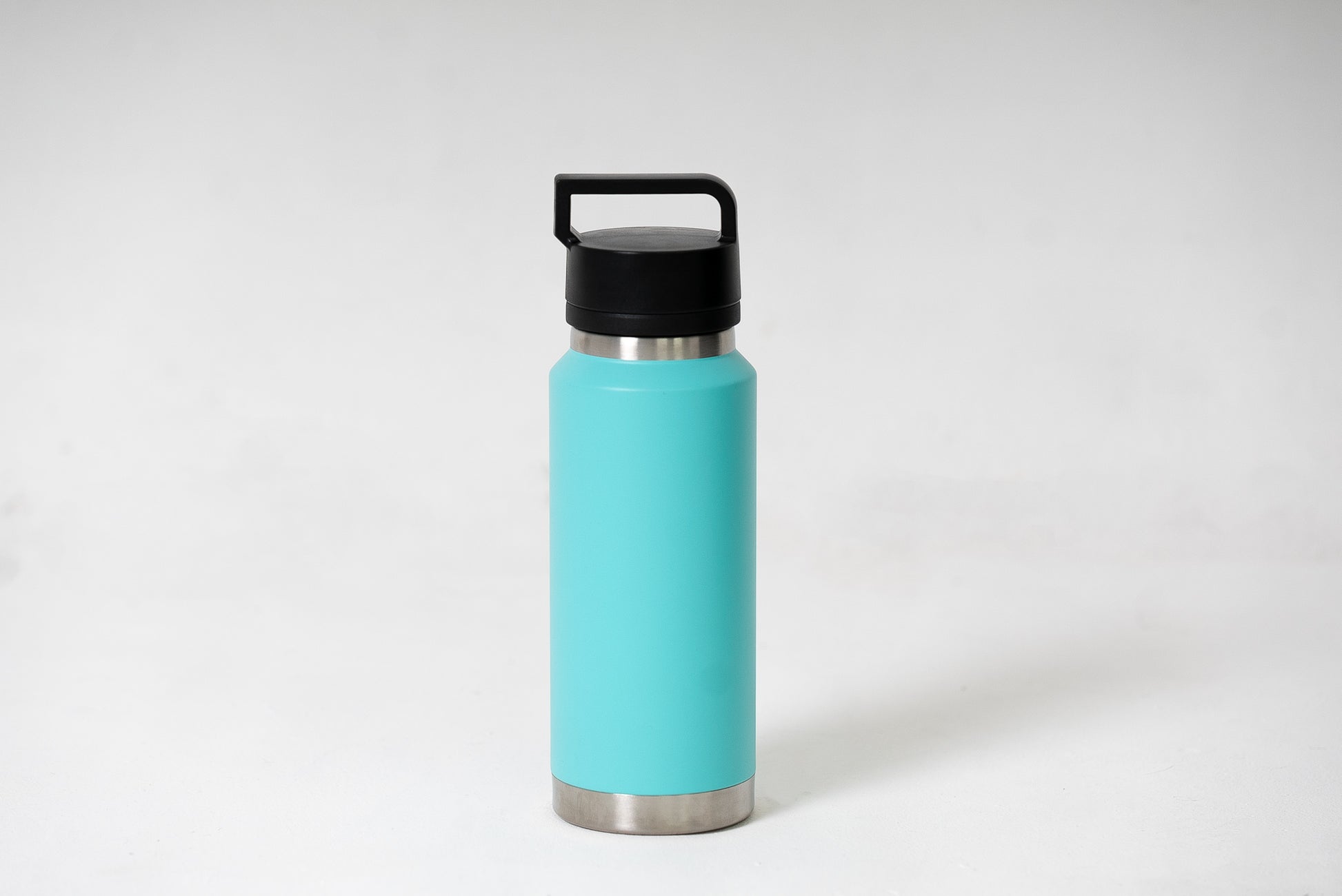 Double-walled water bottle in turquoise with screw top lid and condensation-free design