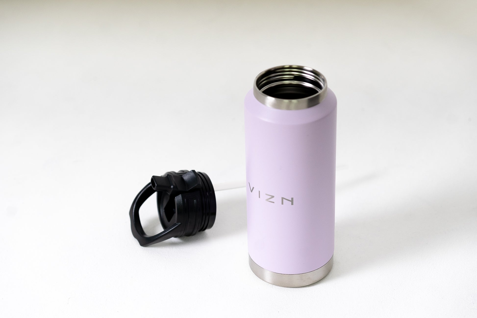 36oz vacuum insulated water bottle with spout lid and carry handle in lilac