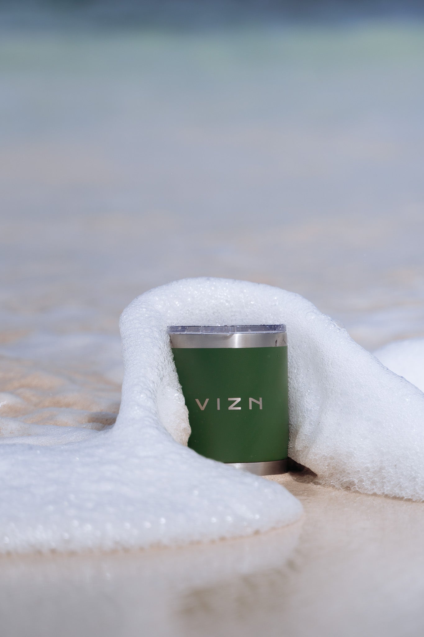Khaki Green OG Tumbler with a steaming hot beverage, illustrating its thermal performance.