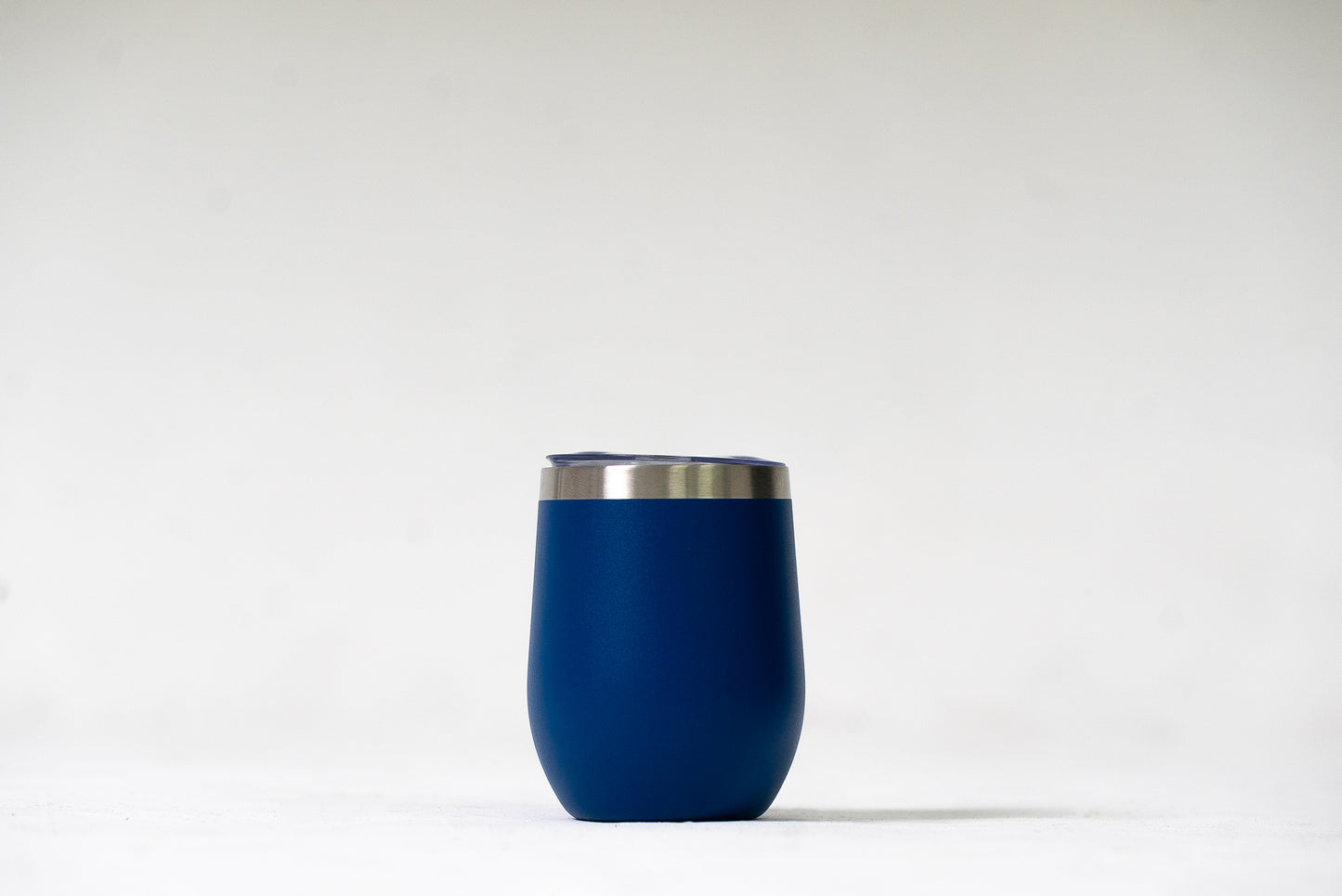 Deep Sea Blue Sipper Tumbler with a close-up view of its sleek stainless steel finish.