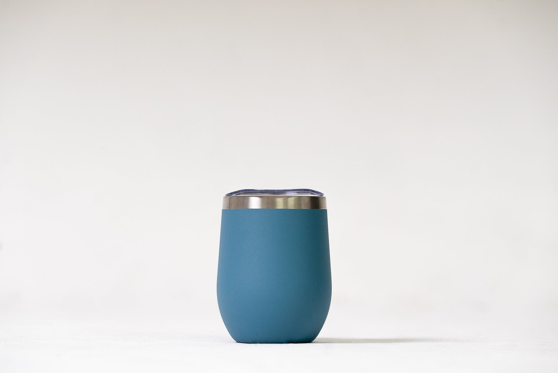 Mist Grey Blue Sipper Tumbler with a close-up view of its sleek stainless steel finish.